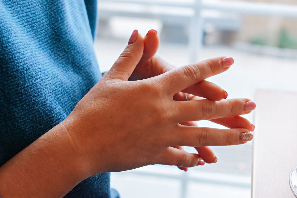 A manicure in progress, close up on polished nails